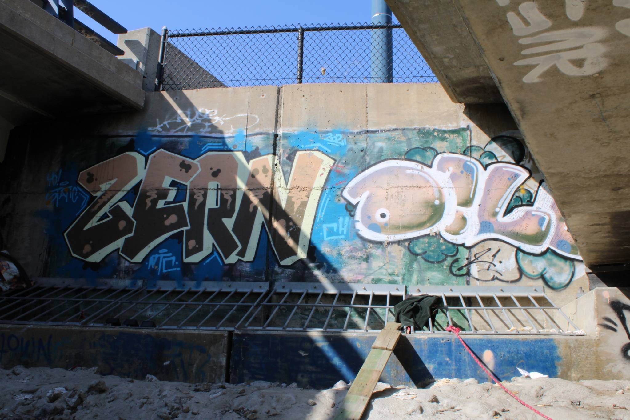 Zern, Dill, Antboy&mdash;Graffiti under MLK Jr. Parkway bridge over Racoon river 